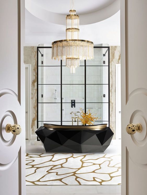 10 a jaw dropping bathtub with a faceted design and a statement chandelier over it for a bold combo