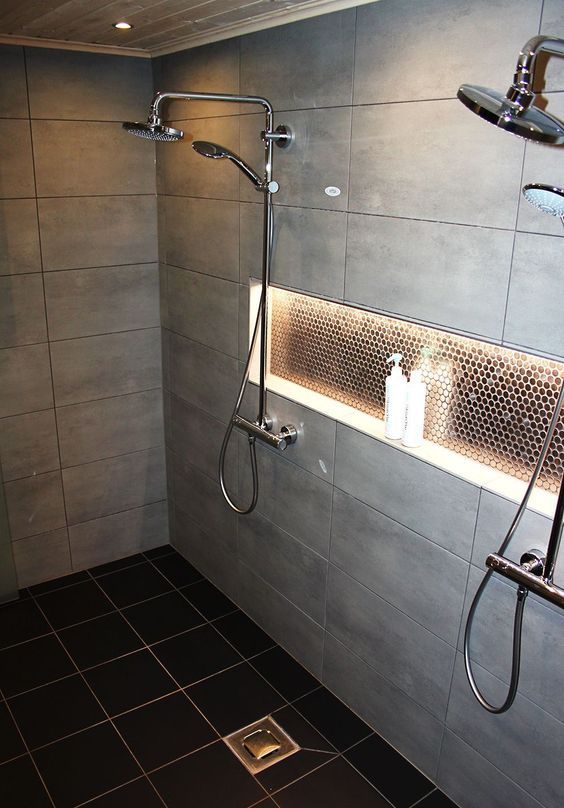23 some built in shower lights on the ceiling and a lit up niche for a cozy feel in the shower