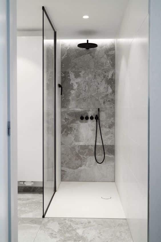 24 built in LEDs and a light in the ceiling are enough to light up such a small shower space
