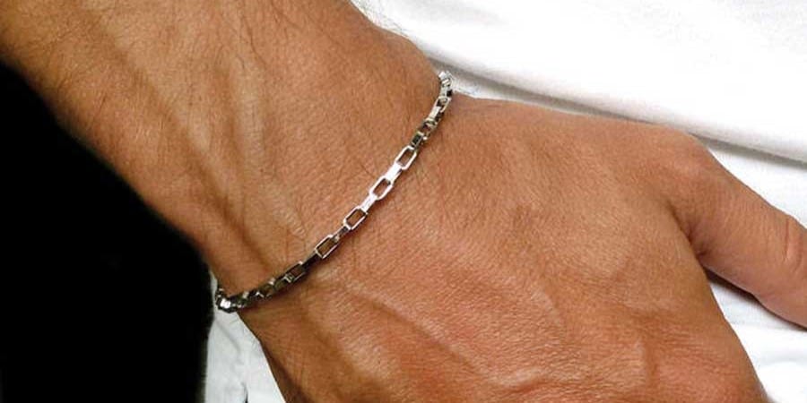 A close-up of a bracelet on a wrist--AI-generated content may be incorrect- - تصویر 1 A close-up of a bracelet on a wrist AI-generated content may be incorrect.